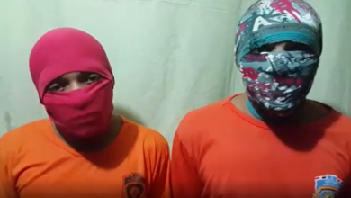 Detentos cobrem o rosto durante o vídeo